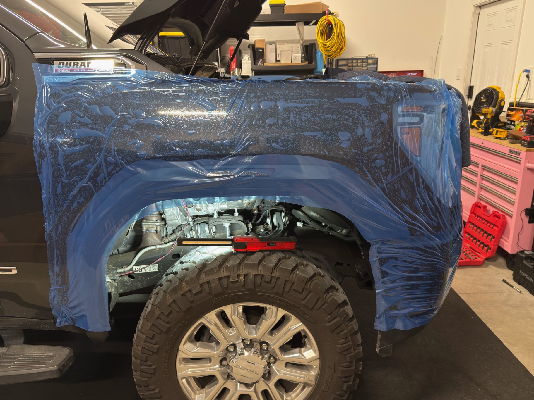 GMC Sierra Denali HD taped off for a build at L&D Performance Diesel