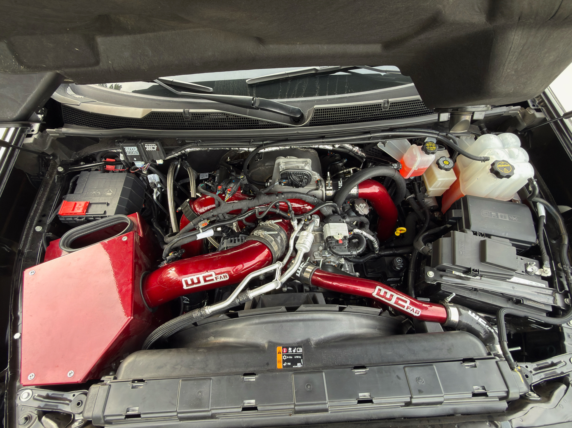 Wide shot of a Duramax engine bay mid-build at L&D Performance Diesel